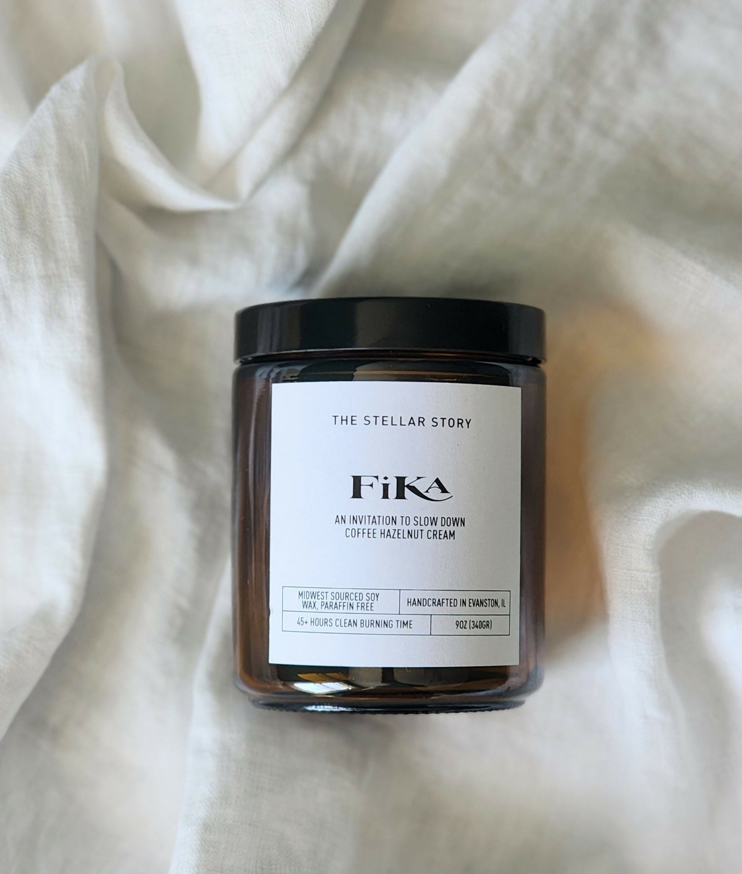 Clean burning candle in a dark brown tinted glass straight jar. Smells like coffee and good time. Small batch, handmade, woman-owned, local.