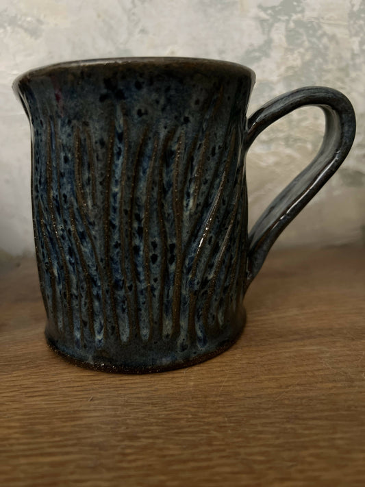 Chocolate creamer with carved surface