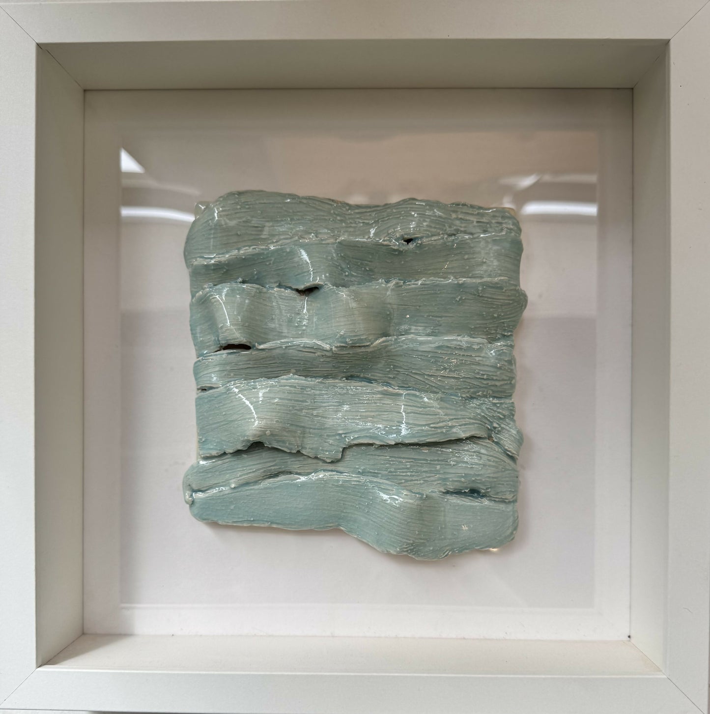 Framed ceramic tile