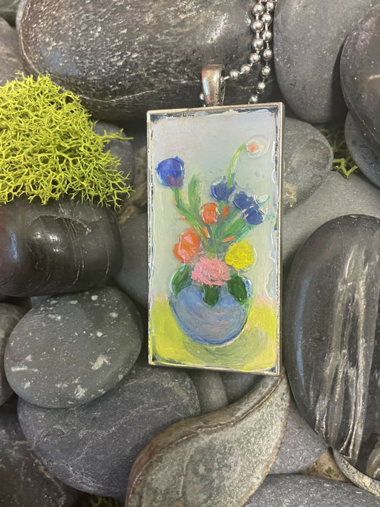 Glass vase pendant with pretty flowers