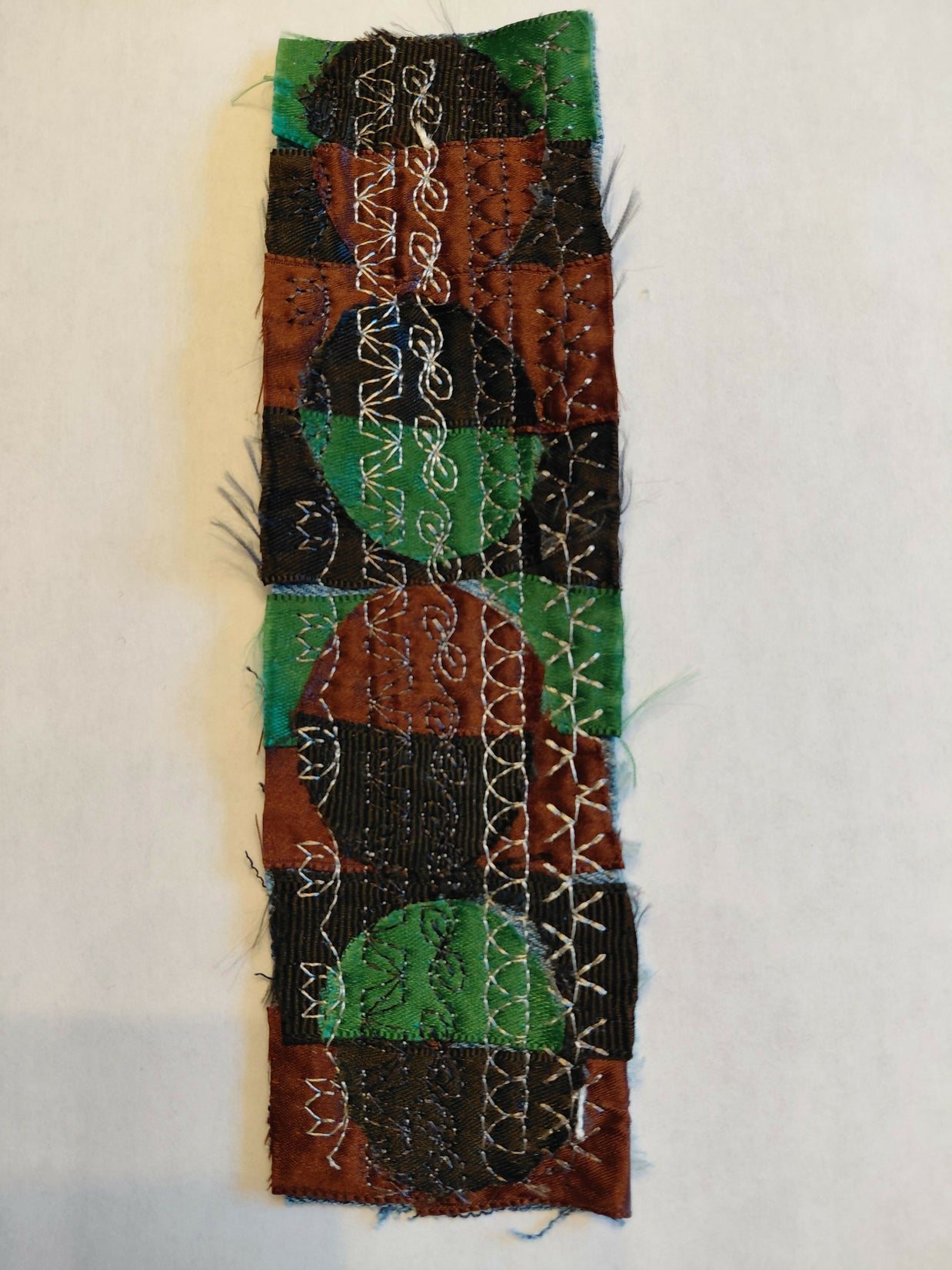 Green, black and brown circles bookmark