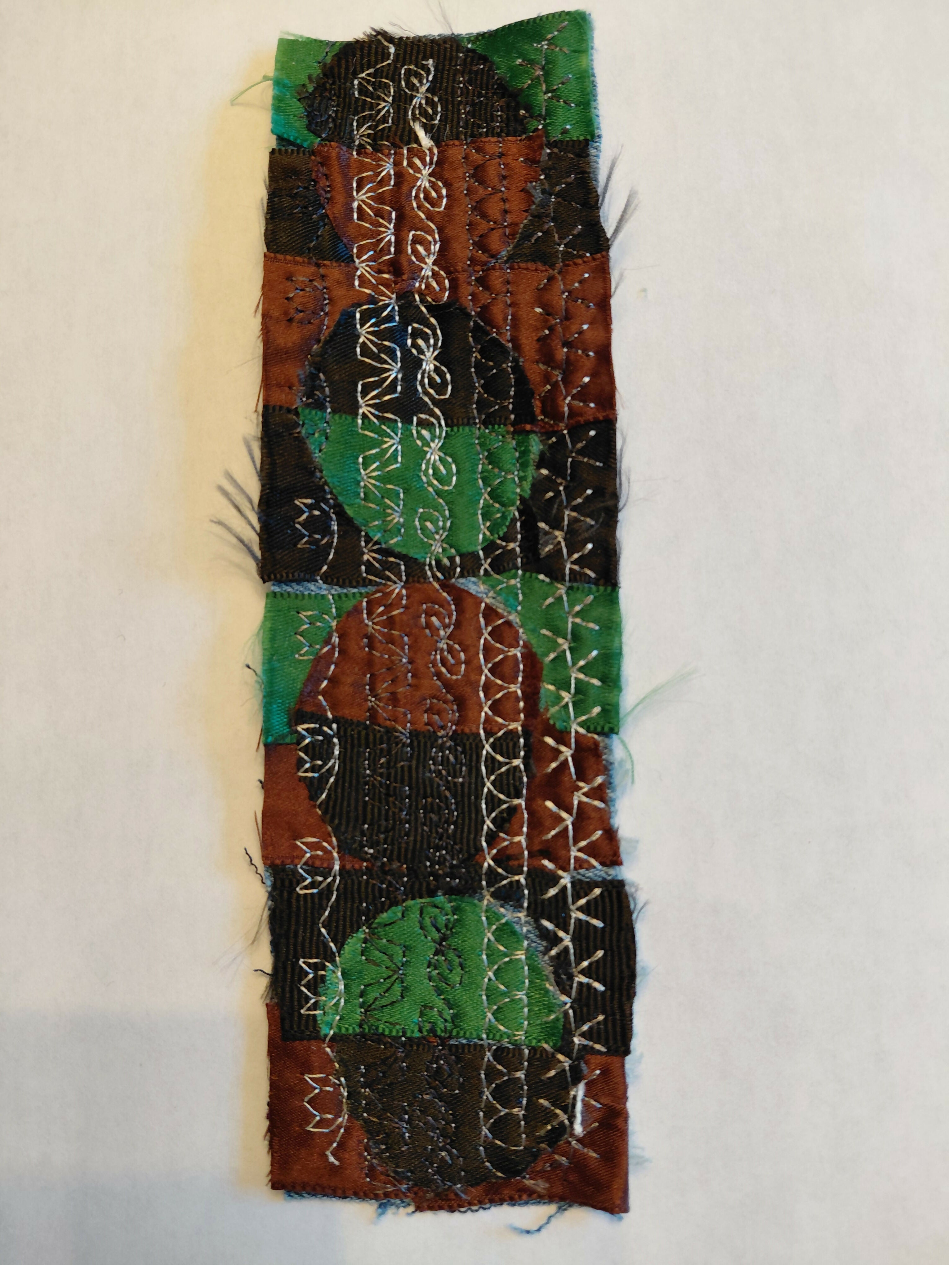 Green, black and brown circles bookmark