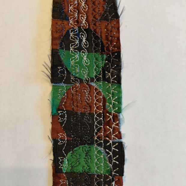 Green, black and brown circles bookmark