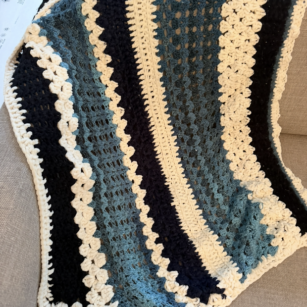 Blue and black criochet throw