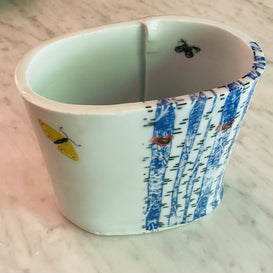 Oval vase-birch trees