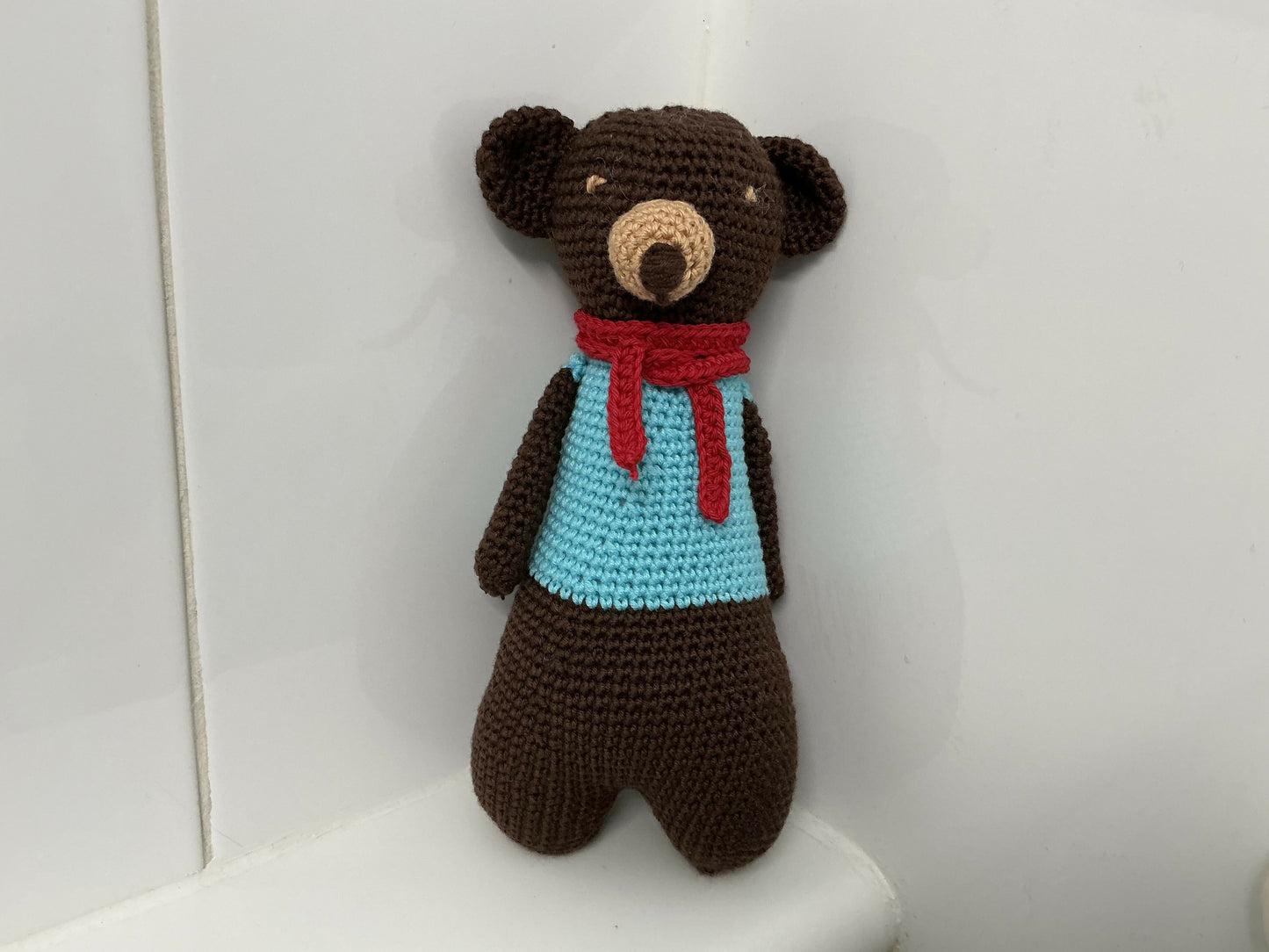 Chocolate bear with a red scarf