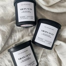 Monaco, travel-inspired candle. Clean burning candle in a black matt glass straight jar. Luxurious and sophisticated scent. Small batch, handmade, woman-owned, local.Monaco, travel-inspired candle. Clean burning candle in a black matt glass straight jar. Luxurious and sophisticated scent. Small batch, handmade, woman-owned, local.