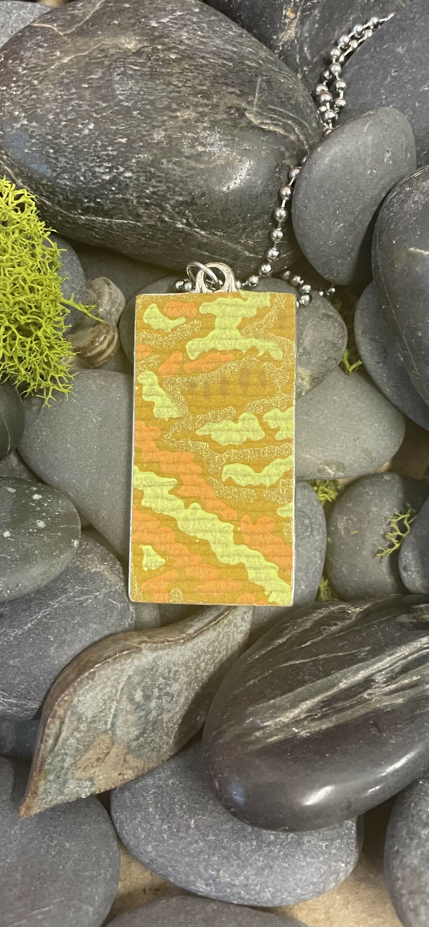 Modern art flower in a landscape pendant