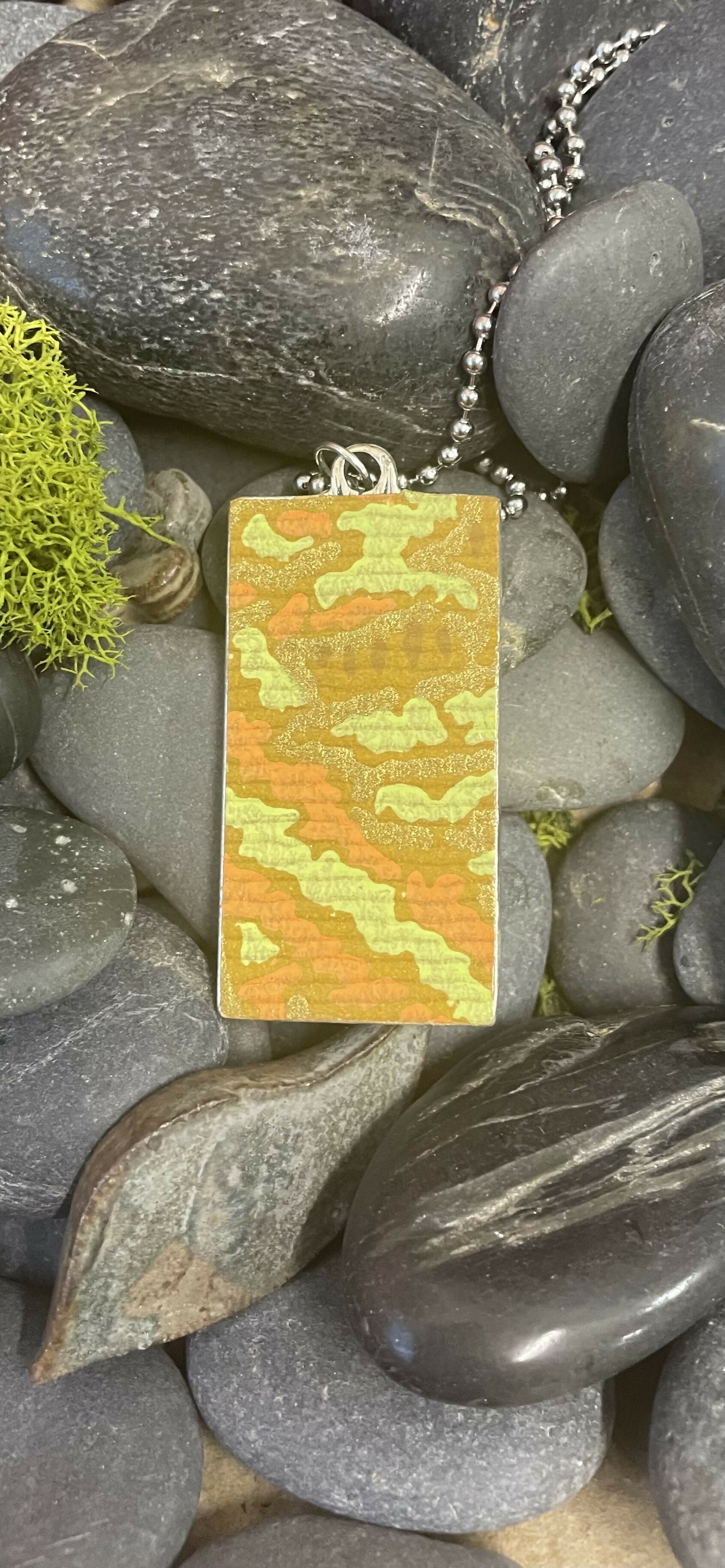 Modern art flower in a landscape pendant