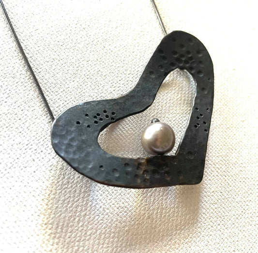 heart with a pearl pendant